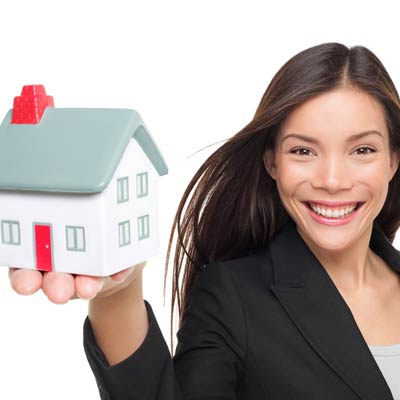 woman holding model home